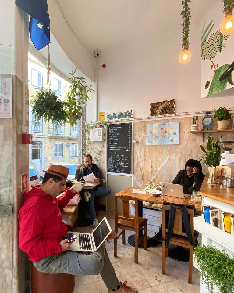 Customers working inside pet-friendly bar Benjamin Coffee House
